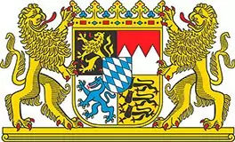 Das Wappen zeigt einen gekrönten Schild, der in vier Abschnitte mit symbolischen Tieren und Motiven unterteilt ist, flankiert von zwei aufrecht stehenden Löwen - ein Emblem, das häufig bei Interregprojekt-Kooperationen zu sehen ist.