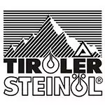 Das schwarz-weiße Logo von Tiroler Steinöl zeigt einen stilisierten Berg mit liniertem Hintergrund und fettgedrucktem Text darunter, der einen vertrauenswürdigen Partner in Sachen Qualität symbolisiert.